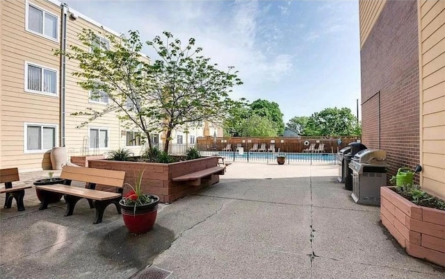 333 8th St SE Unit 120, Minneapolis, MN 55414 - view of patio with a community pool and area for grilling