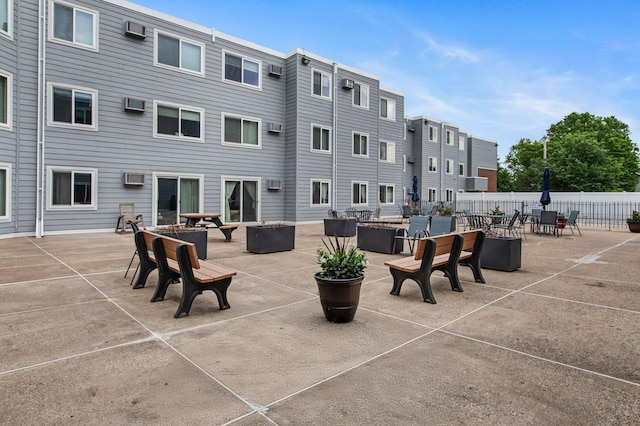 333 8th St SE Unit 120, Minneapolis, MN 55414 - view of patio featuring an AC wall unit