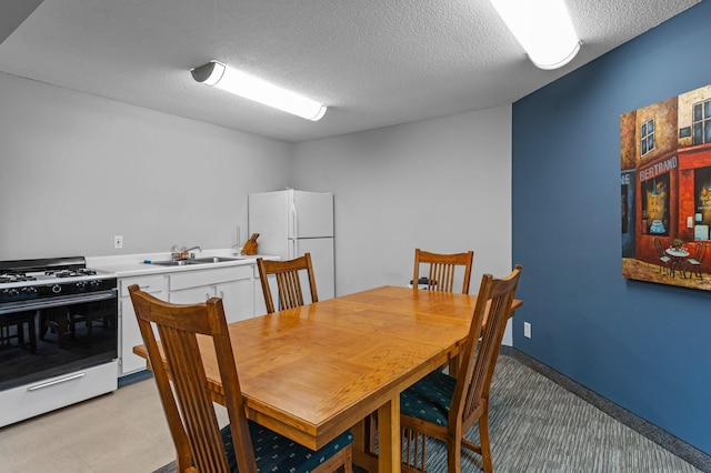 333 8th St SE Unit 120, Minneapolis, MN 55414 - dining area with a textured ceiling