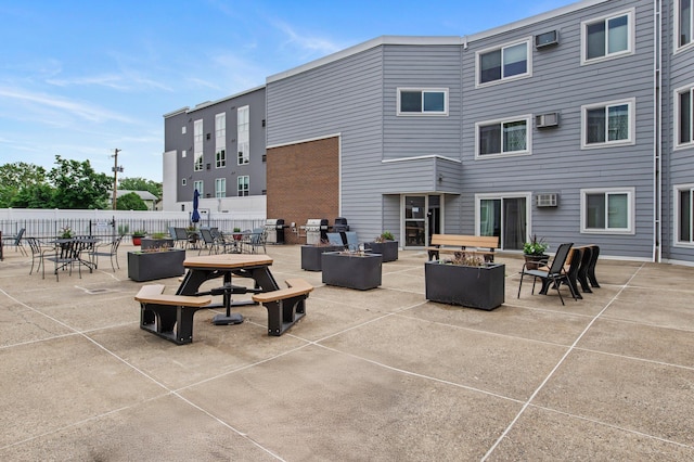333 8th St SE Unit 120, Minneapolis, MN 55414 - view of patio with an AC wall unit and outdoor dining area