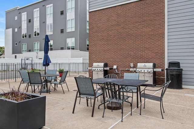 333 8th St SE Unit 120, Minneapolis, MN 55414 - view of patio featuring outdoor dining area and a grill
