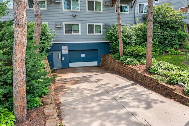 333 8th St SE Unit 120, Minneapolis, MN 55414 - view of side of property with a garage and driveway