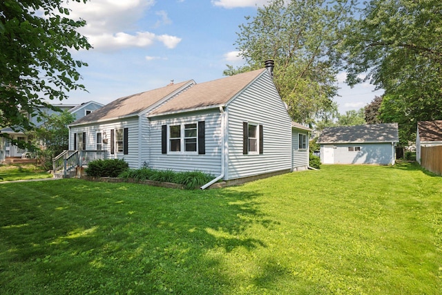 7507 Blaisdell Ave, Richfield, MN 55423 - view of side of home with a lawn and roof with shingles