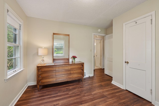 7507 Blaisdell Ave, Richfield, MN 55423 - bedroom with dark wood-type flooring and a textured ceiling