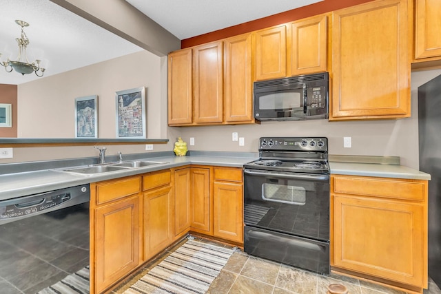4107 Scott Ave N, Robbinsdale, MN 55422 - kitchen featuring black appliances, light countertops, and a chandelier