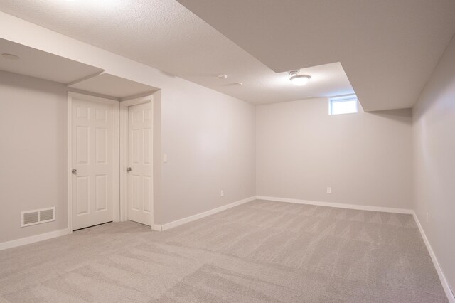 3555 Queen Ave N, Minneapolis, MN 55412 - below grade area featuring light carpet and baseboards