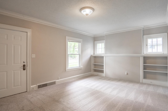 3555 Queen Ave N, Minneapolis, MN 55412 - carpeted empty room featuring crown molding and a textured ceiling