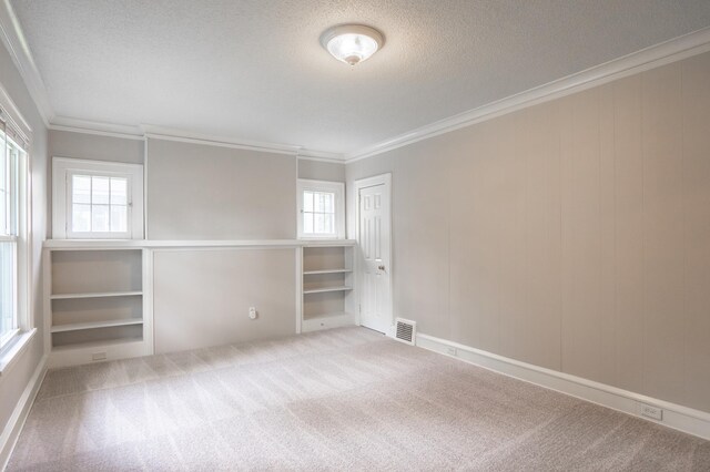 3555 Queen Ave N, Minneapolis, MN 55412 - carpeted spare room with crown molding and a textured ceiling