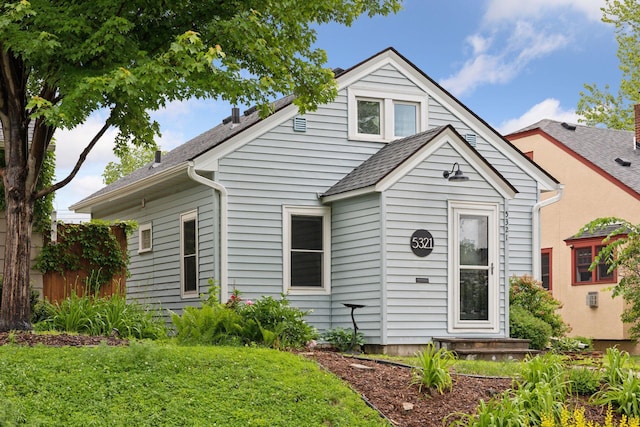 5321 39th Ave S, Minneapolis, MN 55417 - view of front of house with roof with shingles and a front yard