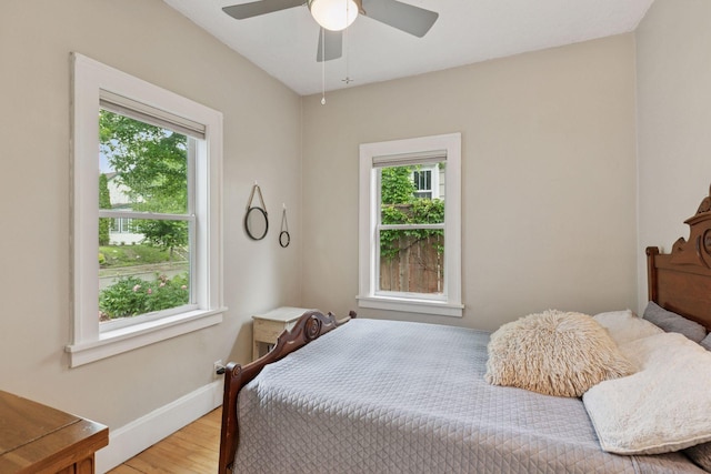 5321 39th Ave S, Minneapolis, MN 55417 - bedroom featuring wood finished floors, multiple windows, and ceiling fan