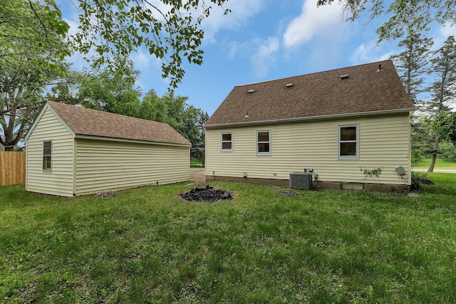 1519 Roosevelt Rd, Saint Cloud, MN 56301 - back of property with a shingled roof and an outdoor structure