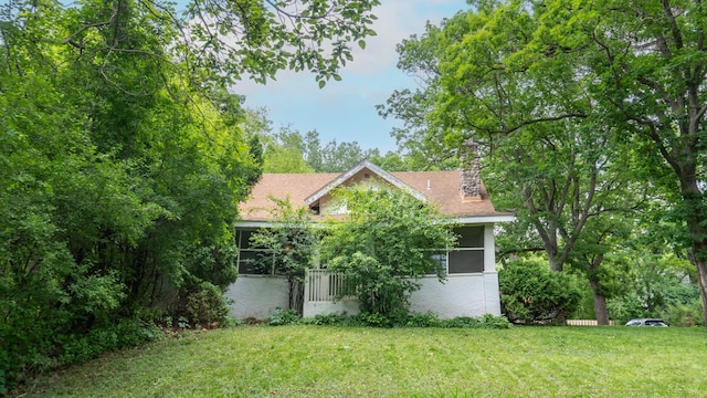 3672 Snelling Ave N, Arden Hills, MN 55112 - view of front of home with a front yard, a chimney, and stucco siding