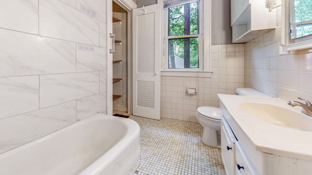 3672 Snelling Ave N, Arden Hills, MN 55112 - bathroom with tile walls, a bathtub, healthy amount of natural light, vanity, and tile patterned floors