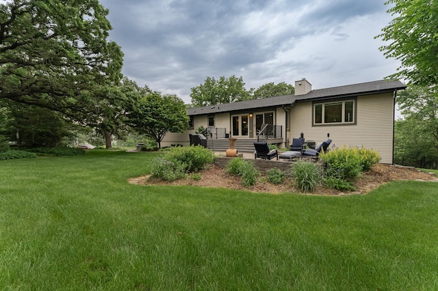 25 Conway Ct SE, Rochester Twp, MN 55904 - rear view of property with a yard, a chimney, and a patio