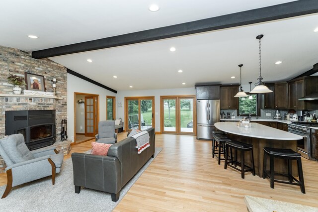 25 Conway Ct SE, Rochester Twp, MN 55904 - living room featuring light wood-style flooring, a fireplace, and recessed lighting