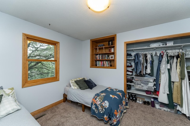 25 Conway Ct SE, Rochester Twp, MN 55904 - carpeted bedroom featuring a closet and a textured ceiling