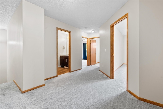 25634 3rd St W, Zimmerman, MN 55398 - hallway with light colored carpet and a textured ceiling