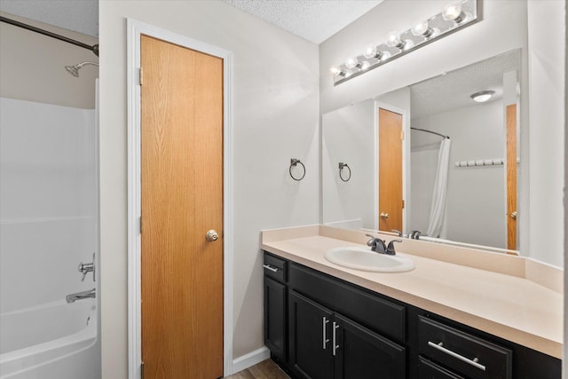 25634 3rd St W, Zimmerman, MN 55398 - bathroom featuring a textured ceiling, vanity, and shower / bath combination with curtain