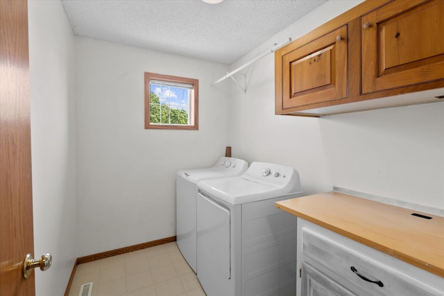 25634 3rd St W, Zimmerman, MN 55398 - laundry area with cabinet space, washer and dryer, and a textured ceiling