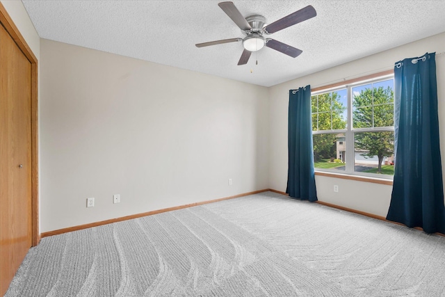 25634 3rd St W, Zimmerman, MN 55398 - carpeted empty room with a textured ceiling and a ceiling fan