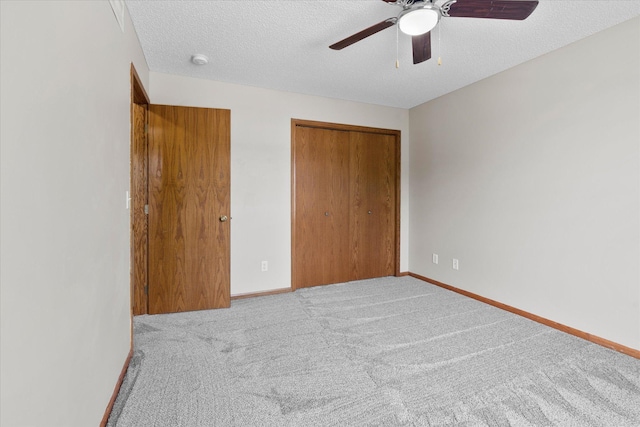 25634 3rd St W, Zimmerman, MN 55398 - unfurnished bedroom with carpet, a closet, a textured ceiling, and ceiling fan
