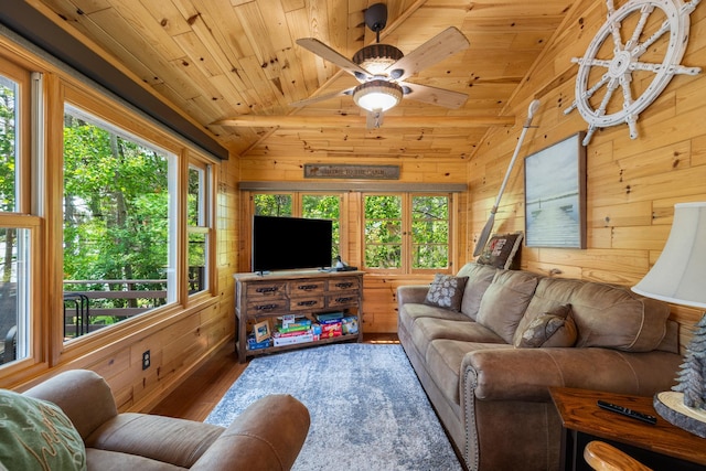 14292 Chippewa Loop, Park Rapids, MN 56470 - living area featuring vaulted ceiling, wood finished floors, wood walls, wood ceiling, and ceiling fan