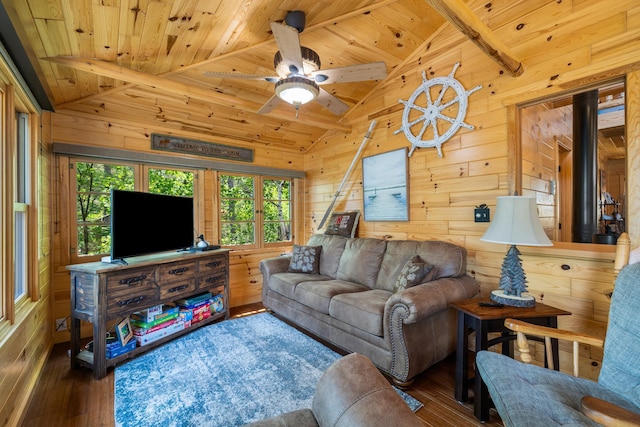 14292 Chippewa Loop, Park Rapids, MN 56470 - living area with hardwood / wood-style floors, wood ceiling, wooden walls, a ceiling fan, and a wood stove