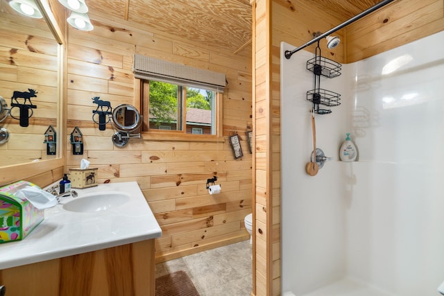 14292 Chippewa Loop, Park Rapids, MN 56470 - full bath featuring wood walls, a shower stall, and vanity