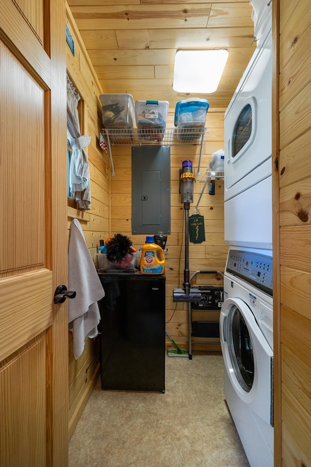 14292 Chippewa Loop, Park Rapids, MN 56470 - washroom with estacked washer and dryer, electric panel, and wood walls
