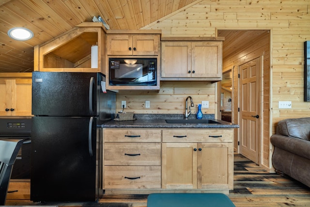 14292 Chippewa Loop, Park Rapids, MN 56470 - kitchen with black appliances, wooden walls, dark wood-style flooring, vaulted ceiling, and light brown cabinetry