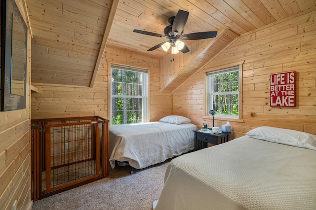 14292 Chippewa Loop, Park Rapids, MN 56470 - carpeted bedroom featuring wooden ceiling, vaulted ceiling, multiple windows, wooden walls, and a ceiling fan
