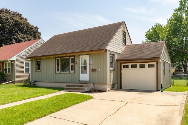 2010 Oakland Ave, Austin, MN 55912 - view of front of property with driveway, a garage, roof with shingles, and board and batten siding