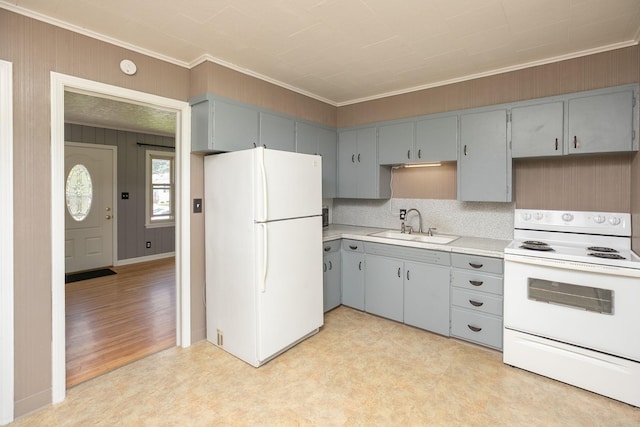 2010 Oakland Ave, Austin, MN 55912 - kitchen with white appliances, light floors, ornamental molding, gray cabinetry, and light countertops