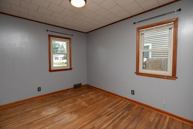 2010 Oakland Ave, Austin, MN 55912 - spare room with crown molding and light wood finished floors
