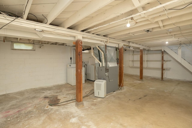 2010 Oakland Ave, Austin, MN 55912 - unfinished below grade area with separate washer and dryer, heating unit, and stairway