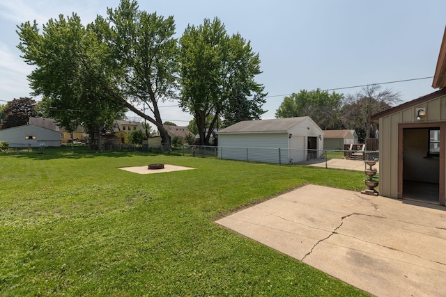 2010 Oakland Ave, Austin, MN 55912 - view of yard with a fire pit, a patio, and an outdoor structure