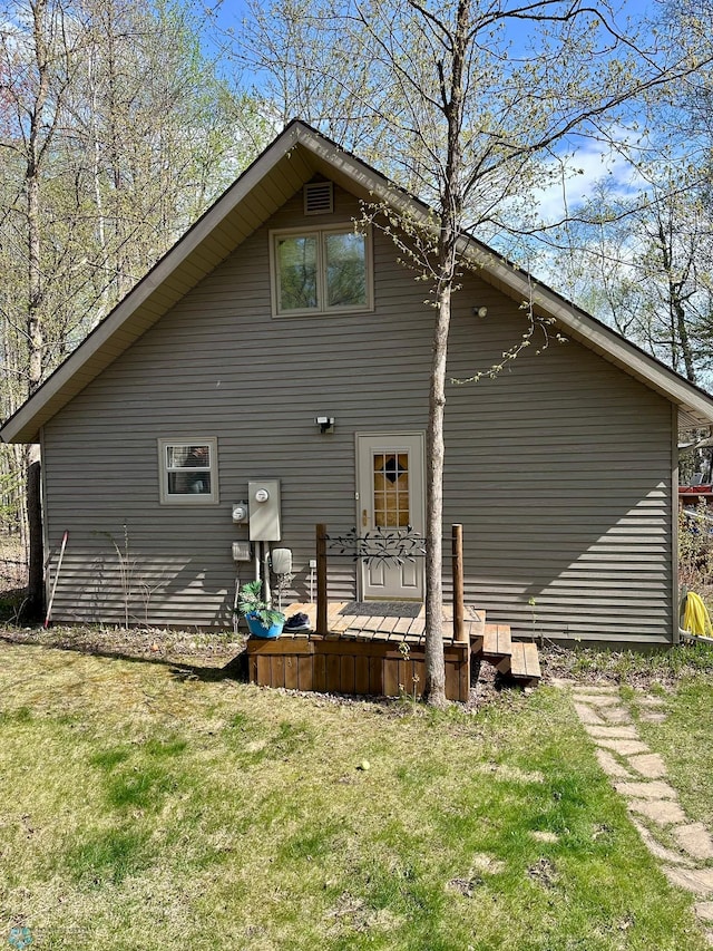 12981 Arcadia Ct NE, Turtle Lake Twp, MN 56601 - back of house with a lawn and a deck