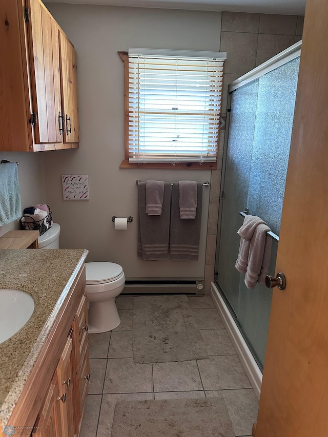 12981 Arcadia Ct NE, Turtle Lake Twp, MN 56601 - bathroom with a stall shower, vanity, baseboard heating, and tile patterned flooring
