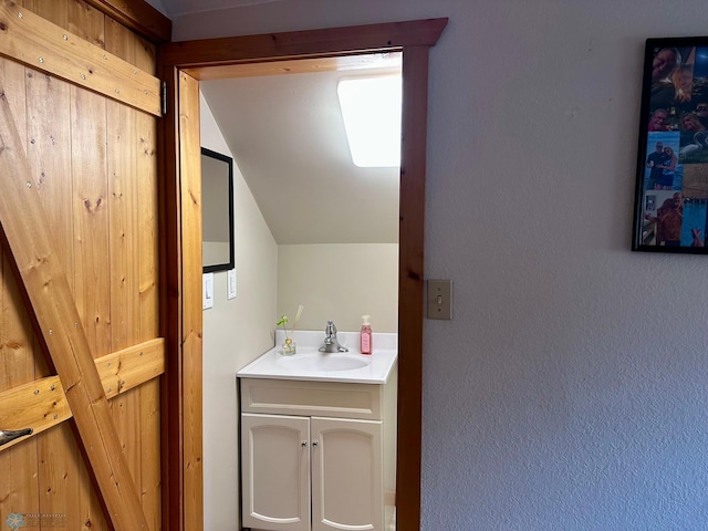 12981 Arcadia Ct NE, Turtle Lake Twp, MN 56601 - bathroom with vaulted ceiling and vanity