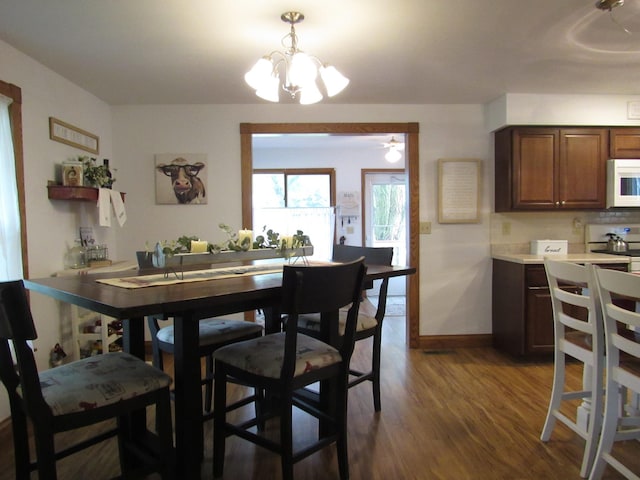 401 St Paul Ave, Fulda, MN 56131 - dining room with dark wood-type flooring and a chandelier