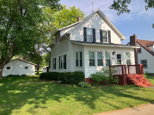 401 St Paul Ave, Fulda, MN 56131 - view of front of house featuring a front lawn, a chimney, and a wooden deck