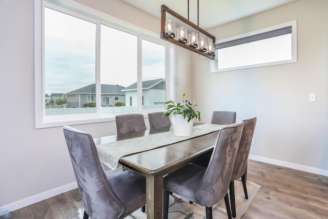 1326 Commander Dr W, West Fargo, ND 58078 - dining space with a chandelier and wood finished floors