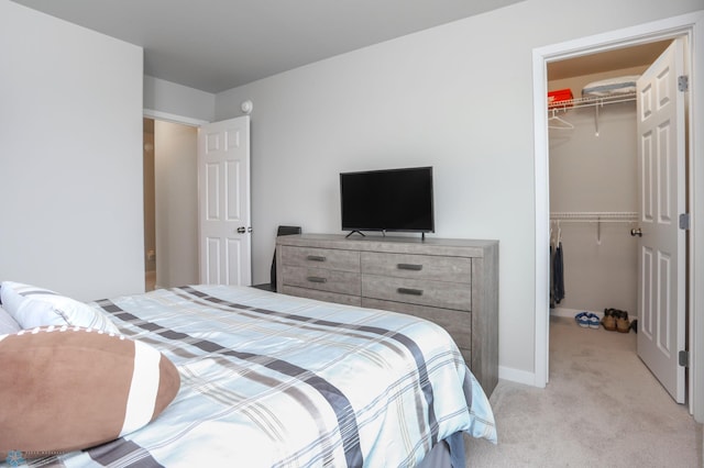 1326 Commander Dr W, West Fargo, ND 58078 - bedroom featuring a spacious closet, a closet, and light colored carpet