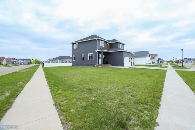 1326 Commander Dr W, West Fargo, ND 58078 - view of front of home with a residential view, a front yard, and a garage