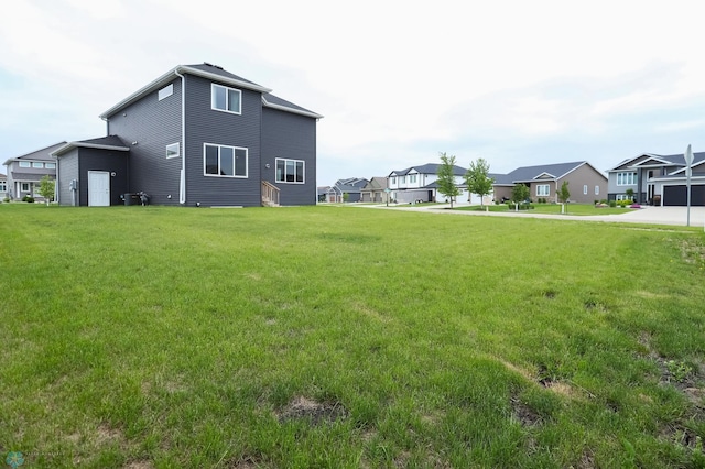 1326 Commander Dr W, West Fargo, ND 58078 - view of green lawn featuring a residential view
