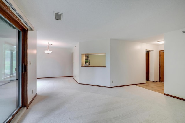 3801 98th St Unit 108, Bloomington, MN 55431 - empty room featuring light colored carpet and baseboards