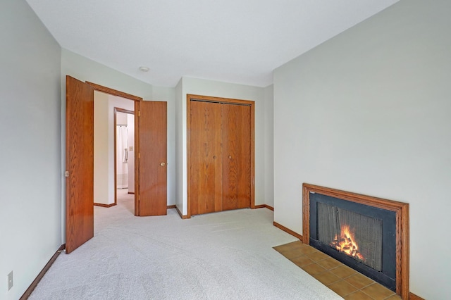 3801 98th St Unit 108, Bloomington, MN 55431 - unfurnished bedroom featuring a fireplace with flush hearth, carpet flooring, and a closet