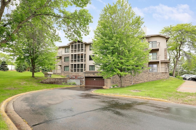 3801 98th St Unit 108, Bloomington, MN 55431 - view of property with driveway and an attached garage
