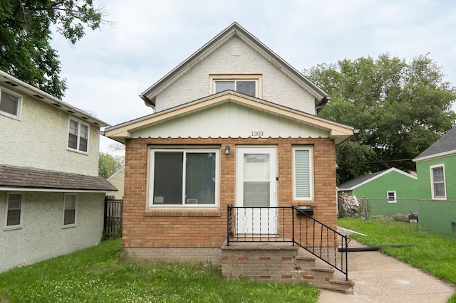 1303 Fremont Ave, Saint Paul, MN 55106 - view of front facade with board and batten siding and brick siding