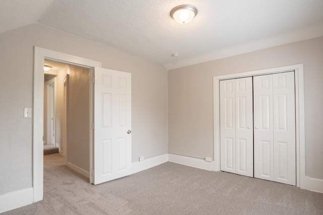 1303 Fremont Ave, Saint Paul, MN 55106 - unfurnished bedroom with carpet floors, a closet, and lofted ceiling
